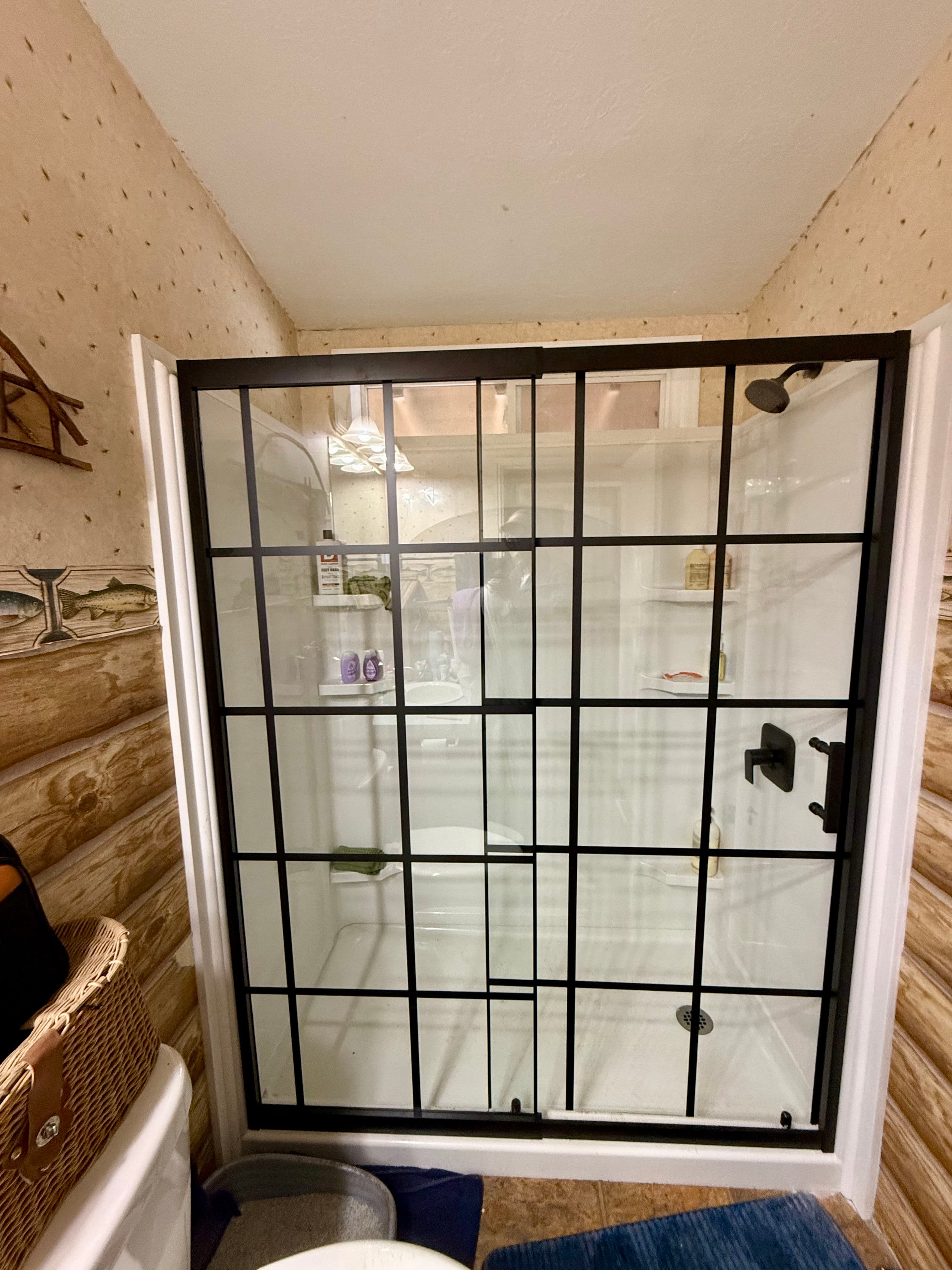 Project Sleek Glass Shower Door Installation in Rustic Bathroom image