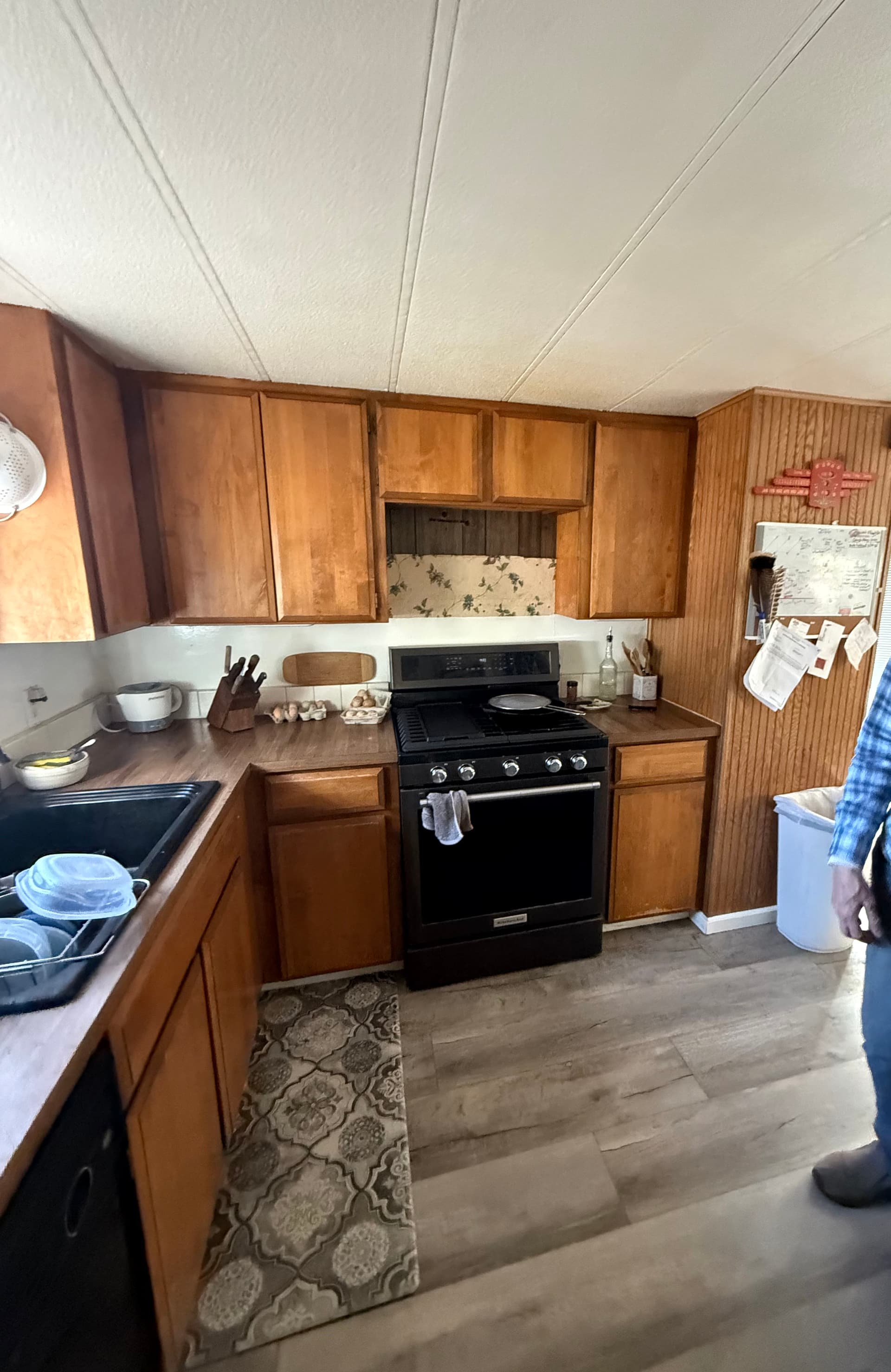 Cabinet Refinish and New Countertops Turn a Dated Kitchen Bright image