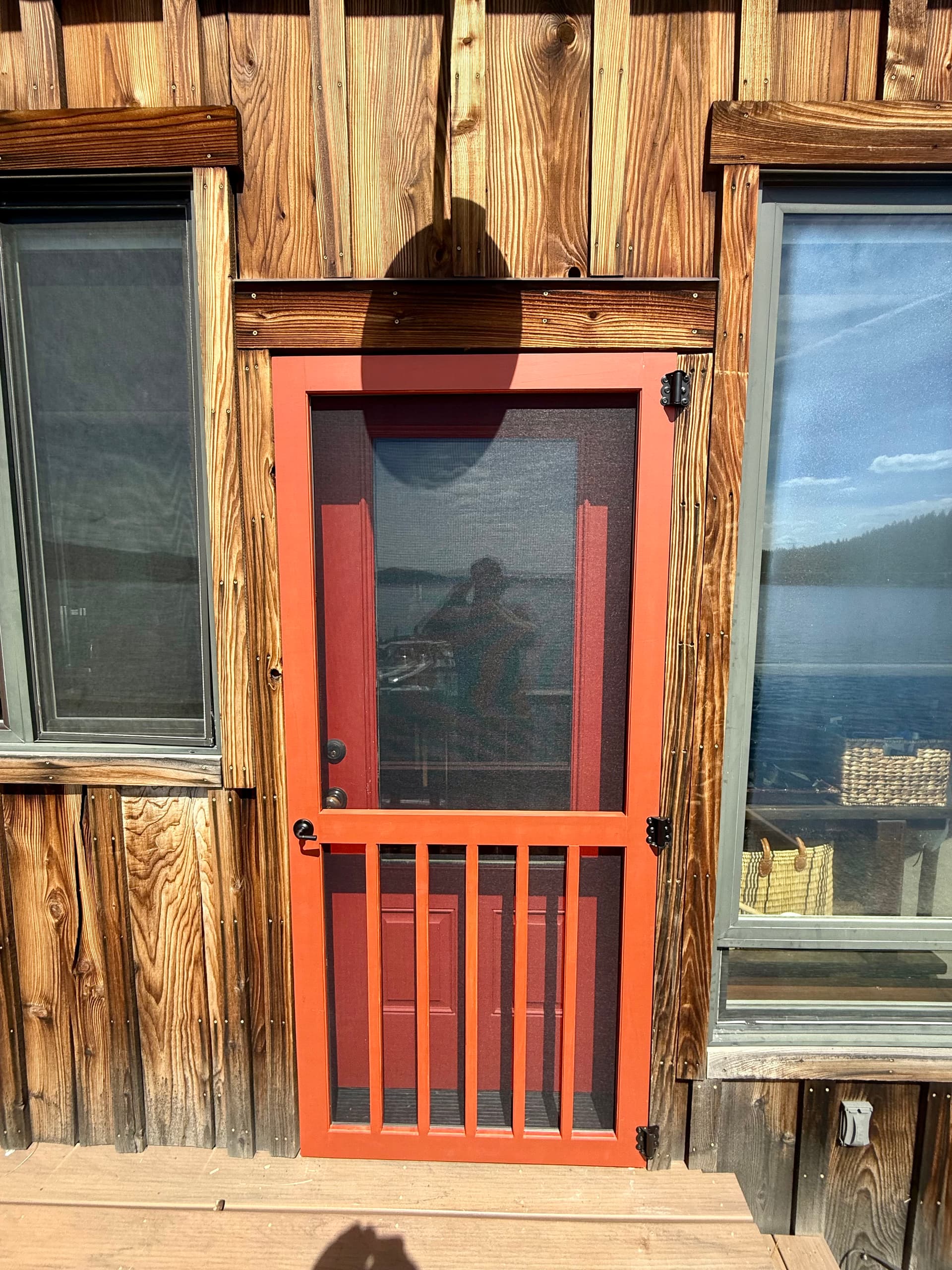 Wood Screen Door Stained to Match a Rustic Exterior image